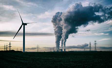 Smoking chimneys and a wind turbine